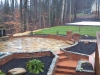 custom-patio-fireplace-volleyball-court